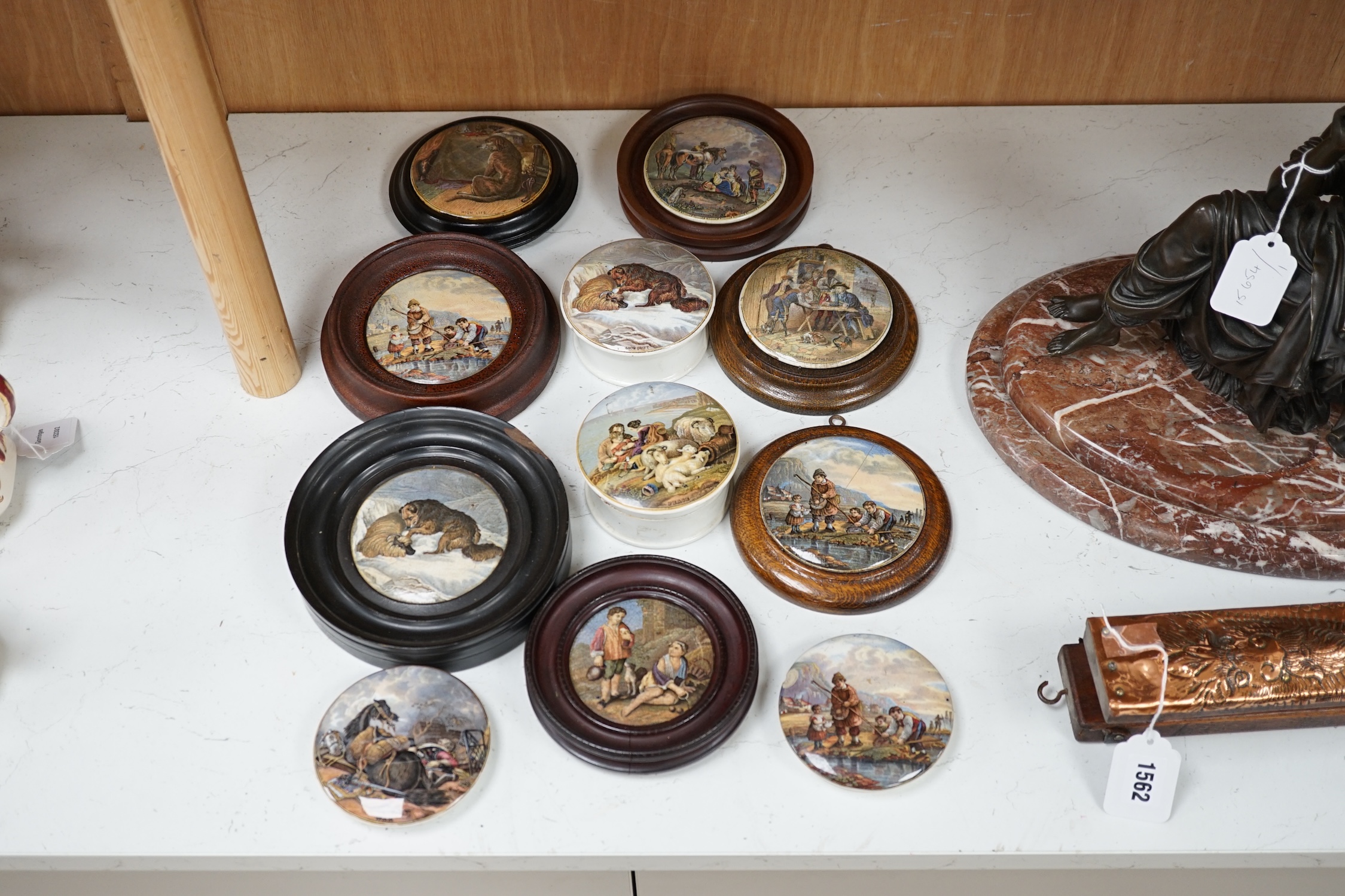 Eleven 19th century mostly framed pot lids including ‘The Snow Drift’, ‘War’, ‘High Life’, etc. Condition - mostly good, one cracked